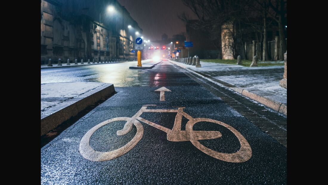 Bicycle Sign On Asphalt On A Bike Road In A Night City