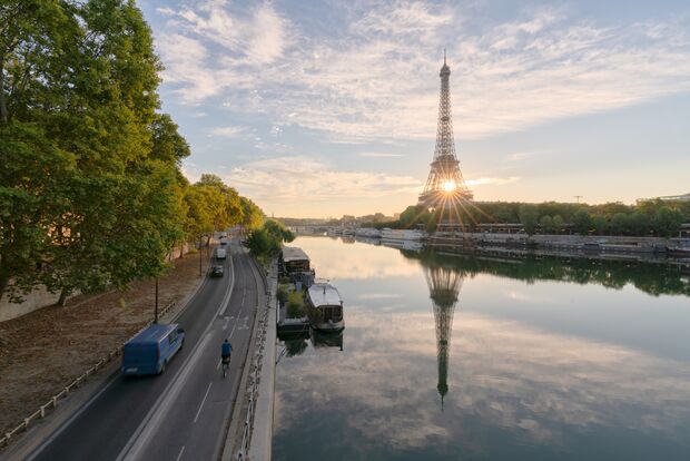 Reflection view of Eiffel tower and river Seine in morning light